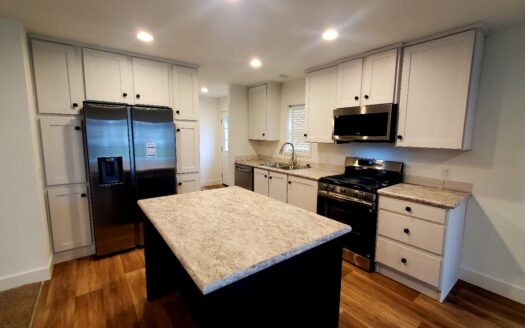 Absolutely Stunning! Huge Built on Covered Porch! 12 Months of Free Lot Rent!