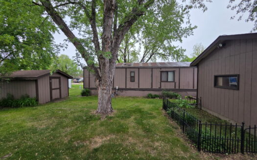 Well Maintained! Large Yard! Matching Shed AND Garage!