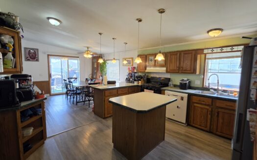 Large Outside Lot! Upgrades Galore! Huge Wrap Around Deck!
