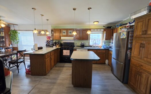 Large Outside Lot! Upgrades Galore! Huge Wrap Around Deck!