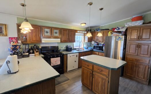 Large Outside Lot! Upgrades Galore! Huge Wrap Around Deck!